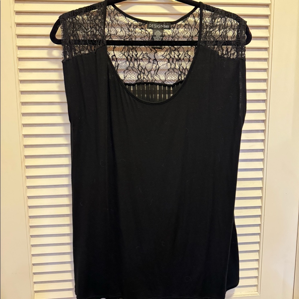 Black top with lace shoulders and fun details!